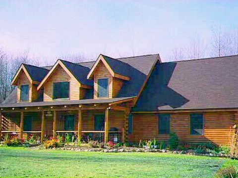 Log home with triple dormers